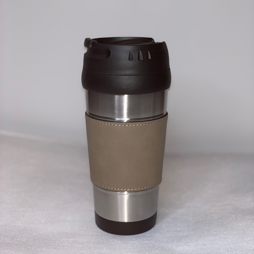 Black and silver mug with tan sleeve